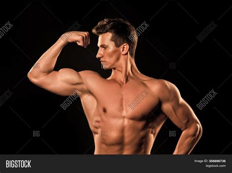 muscular arm flexing|muscles flexing privately.